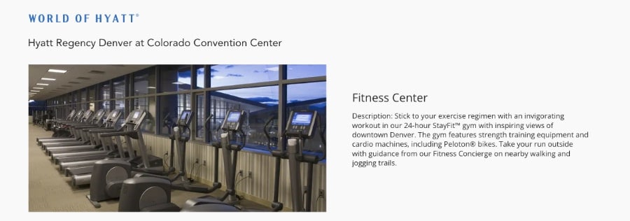 Great example of a hotel gym with treadmills and exercise bikes by large windows, perfect for staying fit while traveling, overlooking a sunset cityscape.
