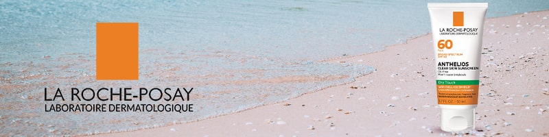 La Roche-Posay sunscreen on the sand, perfect for travel routines.